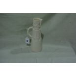 A Royal Worcester Cream Glazed Conical Jug With Stylised Branch And Blossom Handle