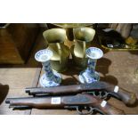 A Pair Of Reproduction Percussion Pistols Together With A Pair Of Candle Sticks And A Pair Of