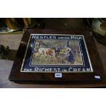 A Nestle's Advertising Print Within A Rosewood Veneer Frame