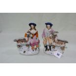 A Pair Of Staffordshire Pottery Groups Of Goats And Herders