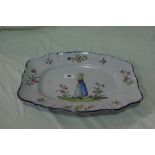 An Oblong Faience Ware Serving Plate With Floral Spray Border And Figural Panel