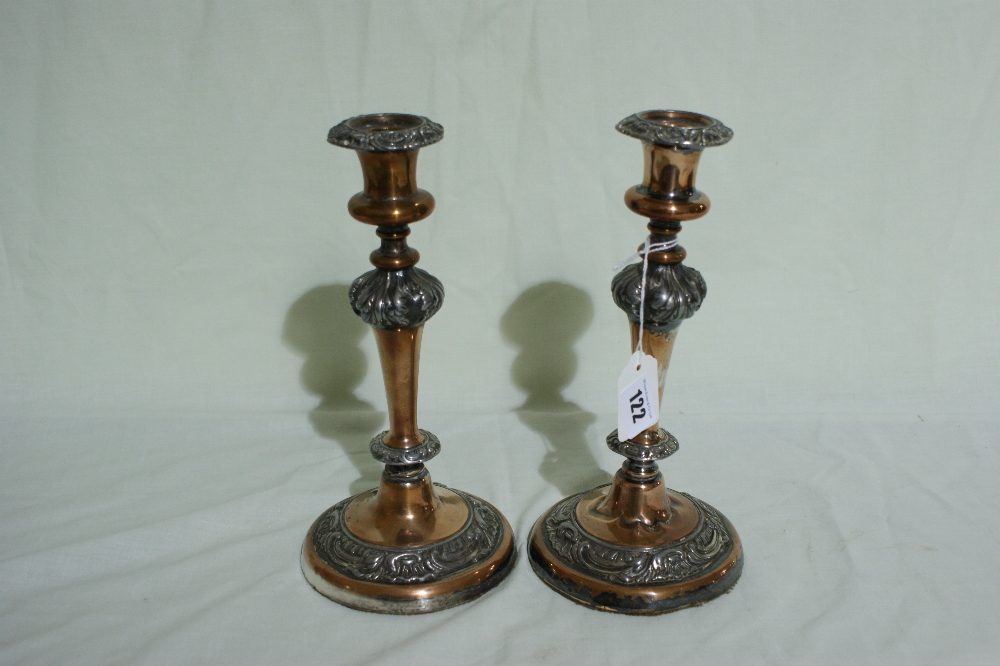A Pair Of Circular Based Sheffield Plate Candle Holders