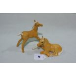 A Beswick Standing Palomino Foal Together With A Beswick Palomino Foal Lying Down