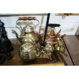 An Antique Copper Kettle Together With A Quantity Of Mixed Brass Kettles