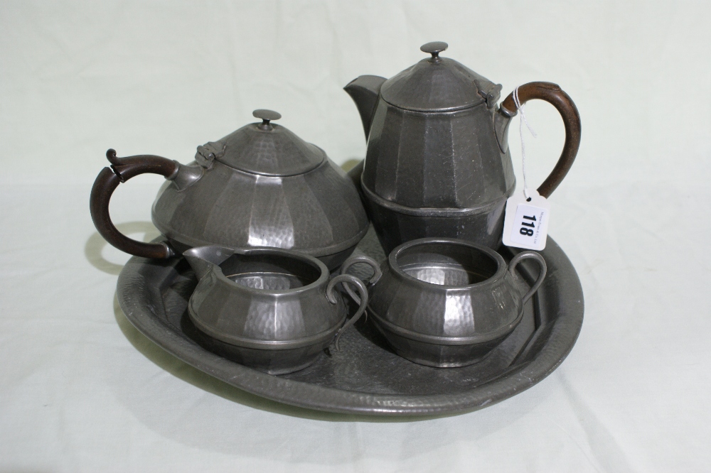 A Four Piece Pewter Tea Service On A Circular Tray