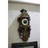 A 20th Century Twin Weight Pendulum Wall Clock