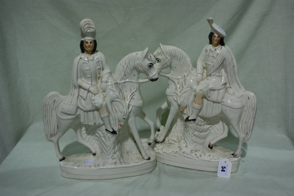 A Pair Of Staffordshire Pottery Scottish Huntsmen Equestrian Figures