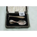 A Boxed Silver Spoon And Pusher Set