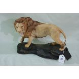 A Beswick Connoisseur Model Of A Standing Male Lion On A Rocky Outcrop