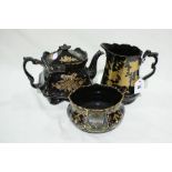 Three Pieces Of Victorian Black Lustre Decorated Pottery Service Ware