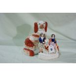 A Staffordshire Pottery Red And White Seated Dog Together With A Staffordshire Pottery Figural