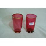 A Pair Of Cranberry Tinted And Gilt Lined Beakers