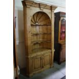 A 20th Century Stripped Pine Two Piece Cupboard With Dome Recess
