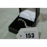 A 9 Carat Gold Emerald And Diamond Set Ring