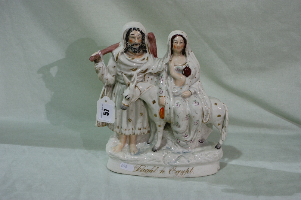 A Staffordshire Pottery Biblical Group "Flight To Egypt"