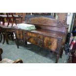 An Early 19th Century Mahogany Sideboard On Turned Corner Supports And Having A Gallery Back