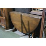 A Mid 20th Century Polished Oak Drop Leaf Table