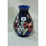 A Circular Based Blue Ground Moorcroft Pottery Bulbous Vase, Signed