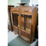 A Polished Oak Two Door Bookcase Cabinet