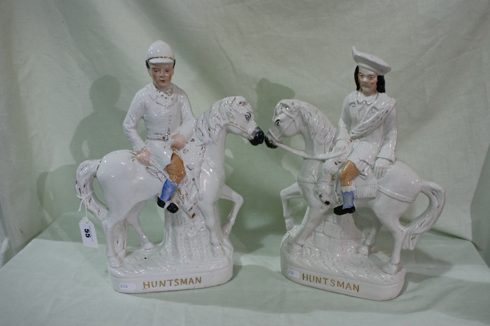 A Pair Of Staffordshire Pottery Huntsmen Decorated Figures