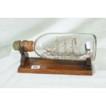 A Vintage Ship In A Bottle On Stand