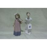 A Lladro Porcelain Figure Of A Child In Night Gown Together With A Nao Porcelain Figure Of A Child
