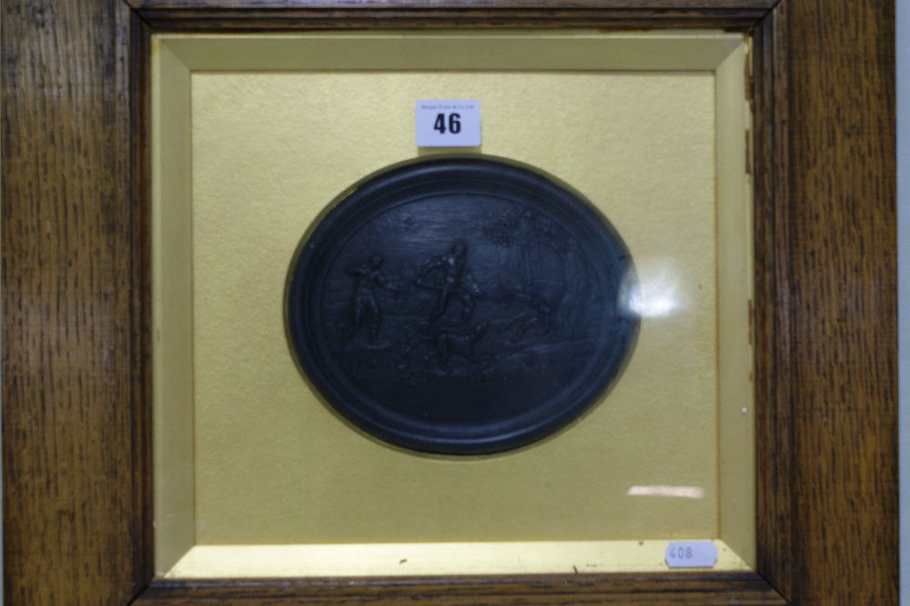 A 19th Century Wedgwood Black Basalt Oval Plaque, Relief Moulded With A Scene Of A Boar Hunt,