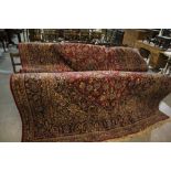 An Excellent Red And Blue Ground Persian Carpet With Successive Borders And Stylised Floral Motifs