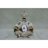 A Continental Porcelain Nodding Figure Of A Seated Mandarin With Moving Head, Tongue And Hands 6"