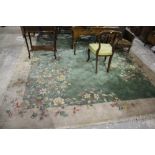 A Large Chinese Woollen Carpet With Green Central Ground And Green Border, Floral Pattern, Approx