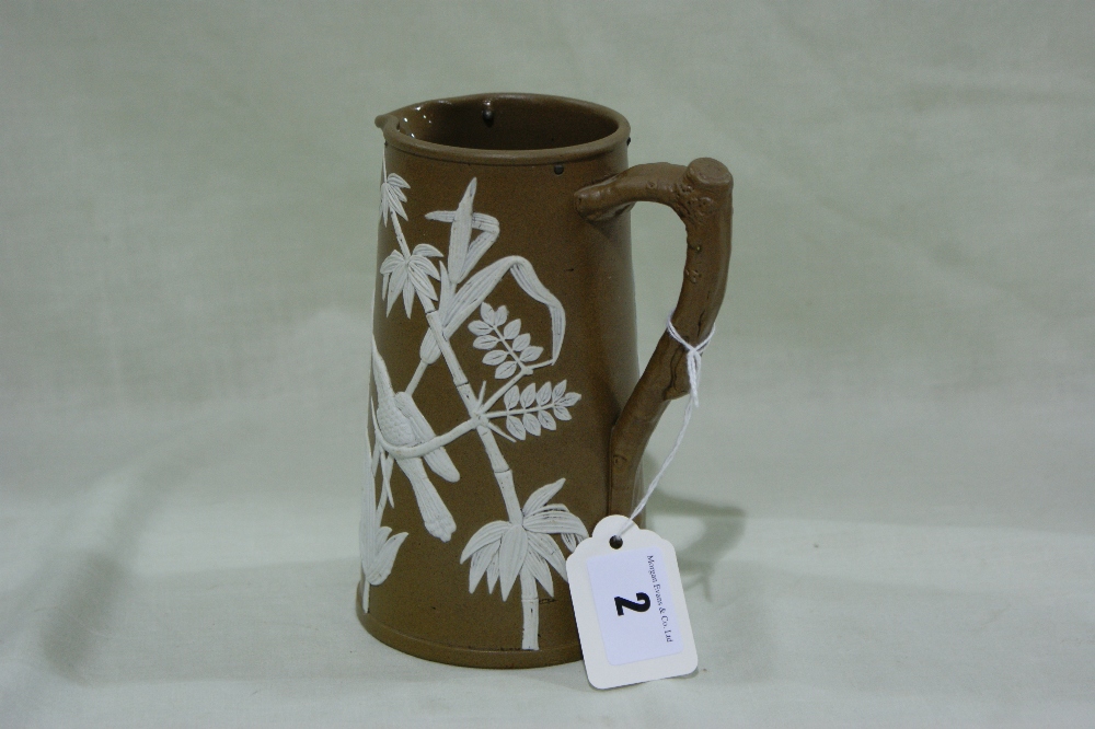 A Dudson Pottery Brown Ground Jasper Ware Style Milk Jug With Bamboo And Bird Decoration