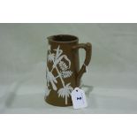 A Dudson Pottery Brown Ground Jasper Ware Style Milk Jug With Bamboo And Bird Decoration