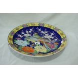 A 20th Century Circular Oriental Charger With Bird And Floral Decoration
