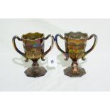 A Pair Of Octagonal Based Purple Carnival Glass Two Handled Vases