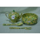 A Ducal Pottery Yellow And Green Transfer Decorated Teapot Together With Matching Salad Bowl And