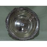 A Circular Based Silver Plated Fruit Stand With Foliate Border
