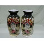 A Pair Of Victorian Floral Decorated Circular Based Milk Glass Vases