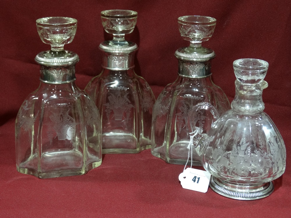 Three Matching Etched Glass Decanters And Stoppers With Foliate Decorated Silver Collars Bearing