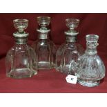 Three Matching Etched Glass Decanters And Stoppers With Foliate Decorated Silver Collars Bearing
