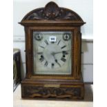 A Carved Oak Encased Bracket Clock With Circular Silvered Dial And Two Subsidiary Dials, Fusee