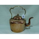 An Antique Copper Kettle With Brass Handle
