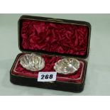 A Pair Of Cased Continental Silver Shell Shaped Salts