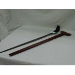 A Tribal Short Sword And Scabbard With Carved Wooden Grip