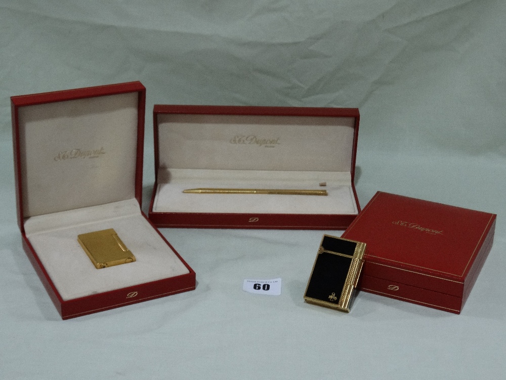 A Boxed Dupont Of Paris Gold Plated And Black Enamel Lighter Together With A Boxed Dupont Gold