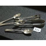 Two Silver Sugar Grips Together With Three Silver Teaspoons