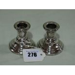 A Pair Of Circular Based Silver Dressing Table Candle Sticks
