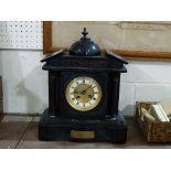 A Victorian Black Marble Encased Mantel Clock With Circular White Enamel Dial