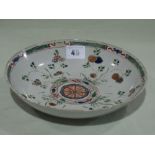An 18th Century Chinese Famille Verte Circular Dish With A Centre Roundel Surrounded By Flowering