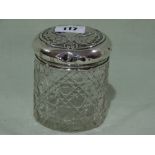 A Cut Glass Dressing Table Jar With Silver Lid
