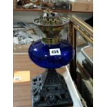 A Square Metallic Based Oil Lamp With Blue Glass Reservoir